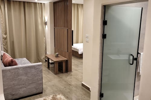 Luxury Triple Room, 1 Bedroom, Non Smoking, City View | Living area | 40-cm LCD TV with satellite channels, TV, fireplace