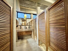 Shower, designer toiletries, hair dryer, towels