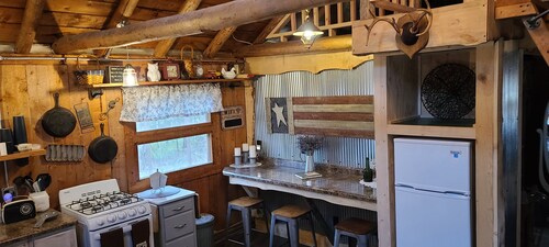 Wood Haven Lodge. Secluded, cozy log cabin in Northern Michigan.