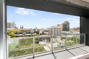 Enjoy a panoramic view of the city from this high-rise's expansive balcony.