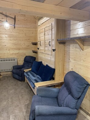 Living area - Rustic off grid cabin (Dinorwic)