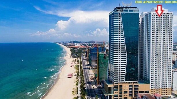 A beachfront hotel with a modern design, located near a beach and ocean. - Muong Thanh Apartment Luxury 03 bedroom (Da Nang)