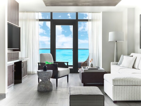 A modern hotel room with a large window offering a view of the ocean. - Kimpton Grand Roatan Resort And Spa by IHG (Roatan)