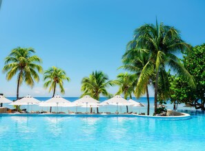 2 outdoor pools, pool umbrellas, pool loungers - Kimpton Grand Roatan Resort And Spa by IHG (Roatan)