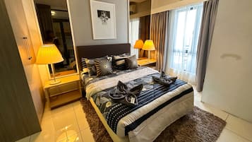 Desk, iron/ironing board, bed sheets