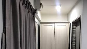 A hallway with a wardrobe, a radiator, and a staircase. - W71  (Bangkok)