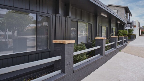 A modern building with large windows and a balcony. - Leeton Centre Motel (Leeton)