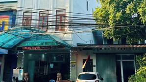 A multi-story building with a sign reading "Luxury Airport Hotel". - Luxury Airport Hotel & Travel (Hanoi)