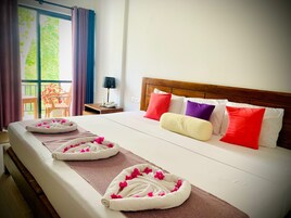 Elite Triple Room, Balcony, Garden View | Memory foam beds, in-room safe, desk, laptop workspace