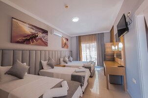 Deluxe Quadruple Room | Premium bedding, in-room safe, soundproofing, iron/ironing board