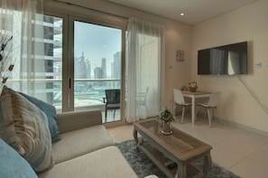 TV, DVD player - Modern Studio at Royal Oceanic JBR by Deluxe Holiday Homes (Dubai)
