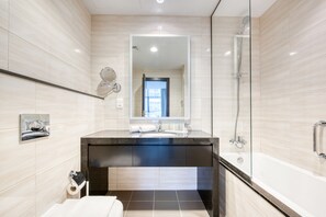 Bathtub, hair dryer, towels, soap