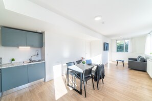 Family Apartment, 2 Bedrooms | Living area | 50-cm Smart TV with cable channels
