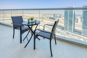 Outdoor dining - Stylish 2BR in Bella Rose Al Barsha South by Deluxe Holiday Homes (Dubai)