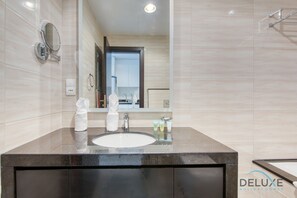 Bathtub, hair dryer, towels