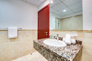 Bathtub, hair dryer, towels