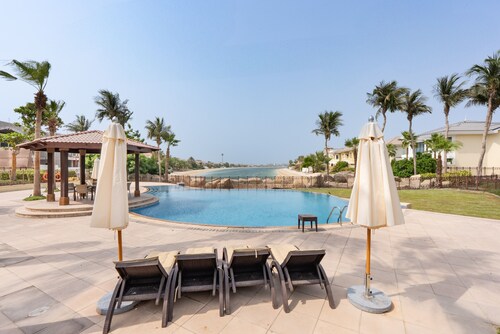 Luxury Beachfront Villa with Direct Beach Access, Next to Community Pool