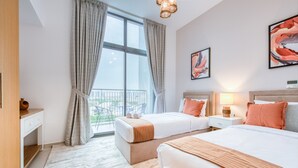 A hotel room with two beds, a desk, a chair, and a balcony with a view. - Fresh 2BR at Mudon Views 4 Dubailand by Deluxe Holiday Homes (Dubai)