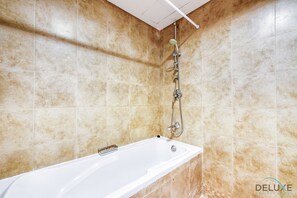 Bathtub, hair dryer, towels