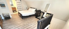 1 habitación y tabla de planchar con plancha 