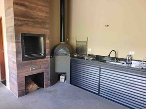Villa | Private kitchen | Full-size fridge, microwave, oven, stovetop