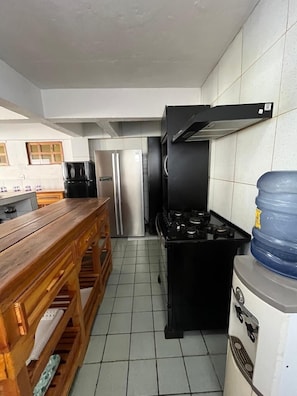 Villa | Private kitchen | Full-size fridge, microwave, oven, blender