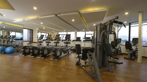 A gym with treadmills, elliptical machines, and weight equipment. - Platinum Hotel and Spa (Kathmandu)