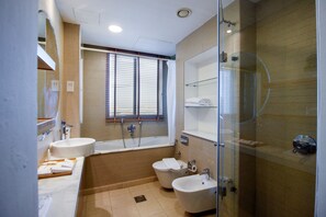 Bathtub, hair dryer, towels, soap