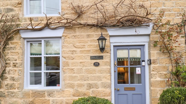 A stone building with a blue door, a window, and a sign reading "Rose House." - Riseholme (Scarborough)