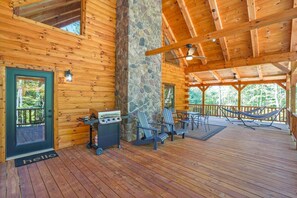 Relax on the covered porch with Adirondack chairs and a hammock, and enjoy outdoor cooking facilities.