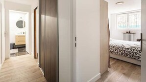 A bedroom with a bed, a window, and a radiator. - Amazing flat, Paris suburb, near Versailles ,Orly (Orsay)