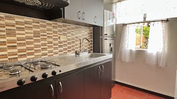 Microwave, coffee/tea maker, toaster, cookware/dishes/utensils