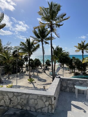 Property grounds - Beachfront views of pristine sandy beach, clear blue waters and surreal sunsets. (Bennett's Harbour)