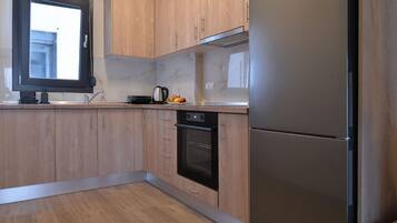 Deluxe Duplex | Private kitchen | Fridge, stovetop, cookware/dishes/utensils, cleaning supplies