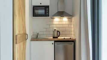 Mini-fridge, microwave, toaster oven, cookware/dishes/utensils