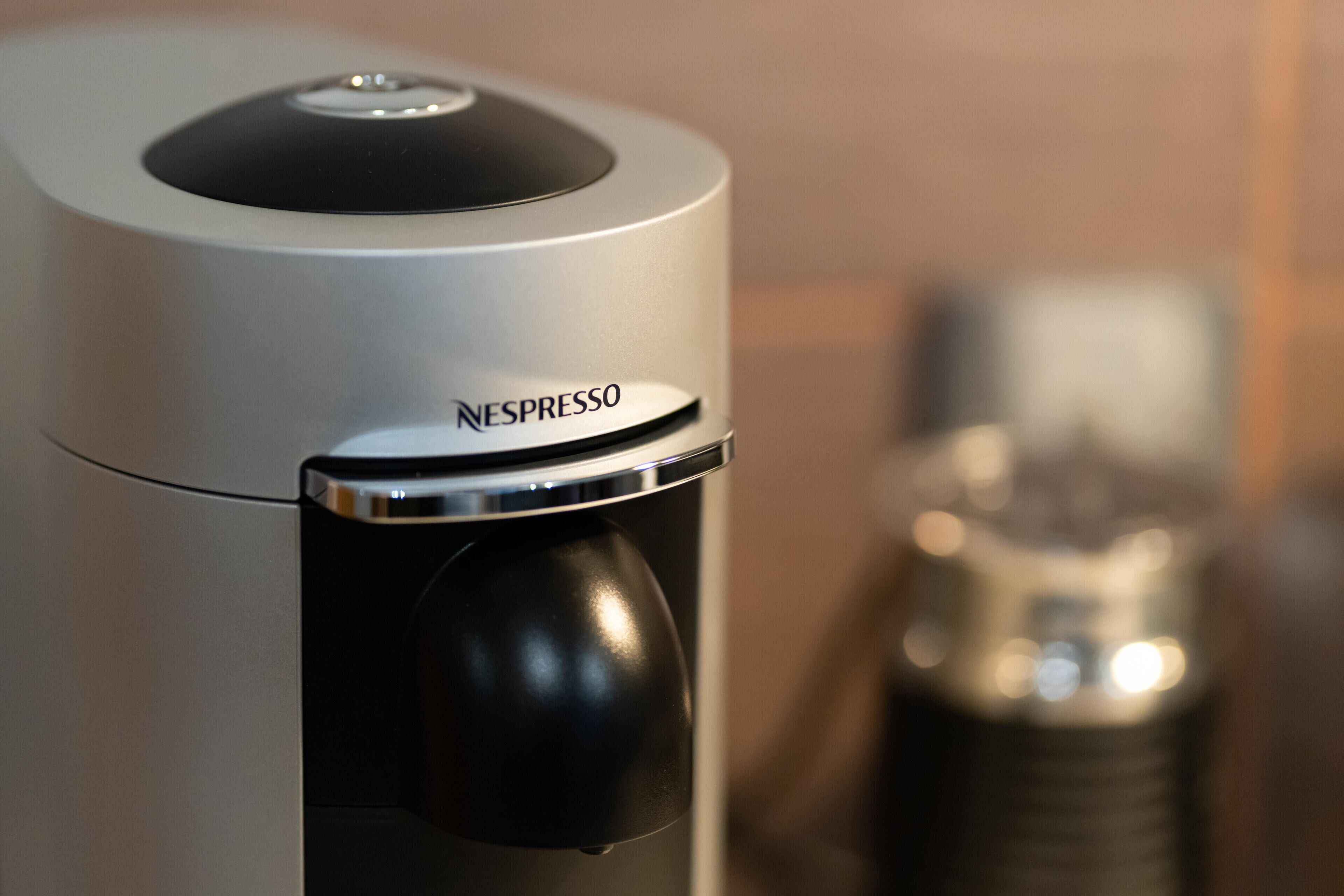 A Nespresso coffee machine with a sleek, modern design.