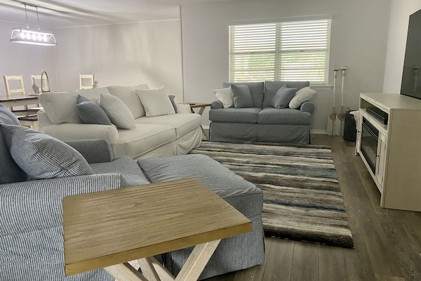 Living room has a pull-out Queen sleeper sofa.