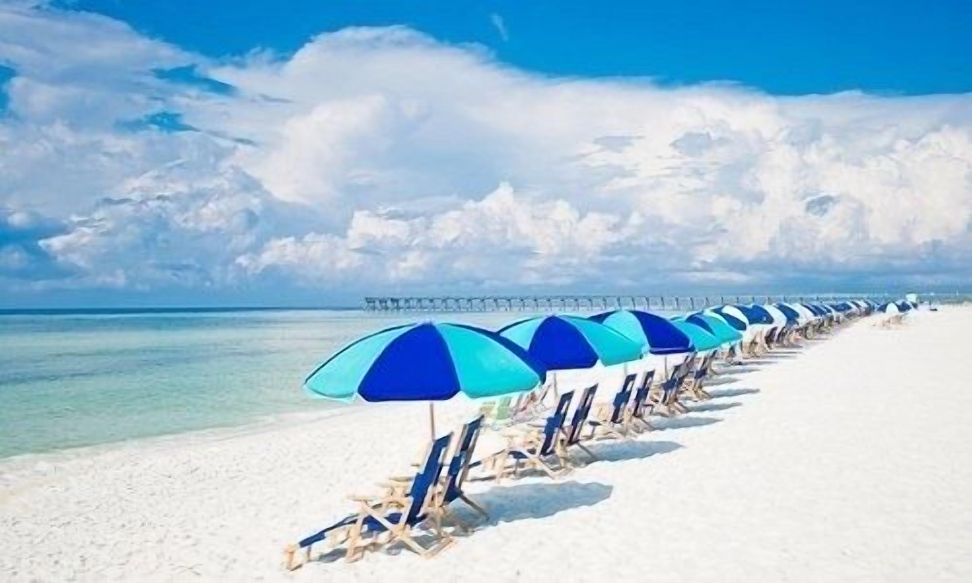 Pensacola Beach white sand beaches and emerald waters.