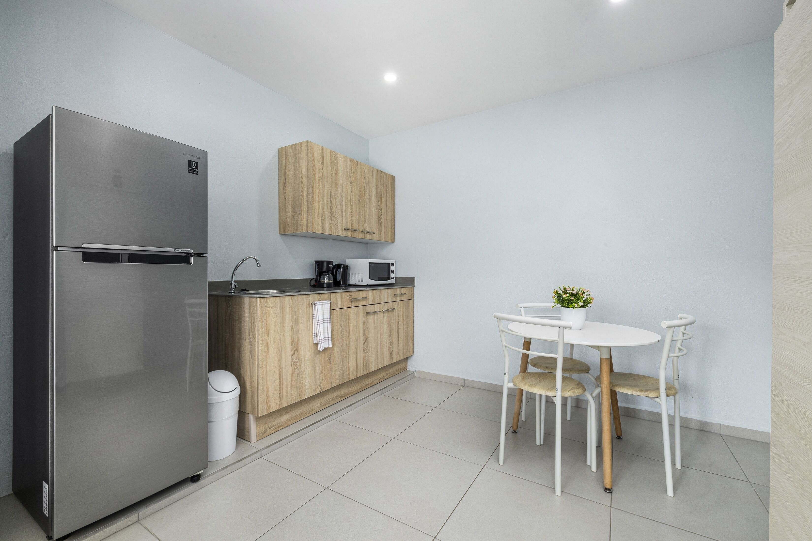 Fridge, microwave, stovetop, coffee/tea maker