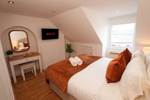 1 bedroom, desk, iron/ironing board, travel crib