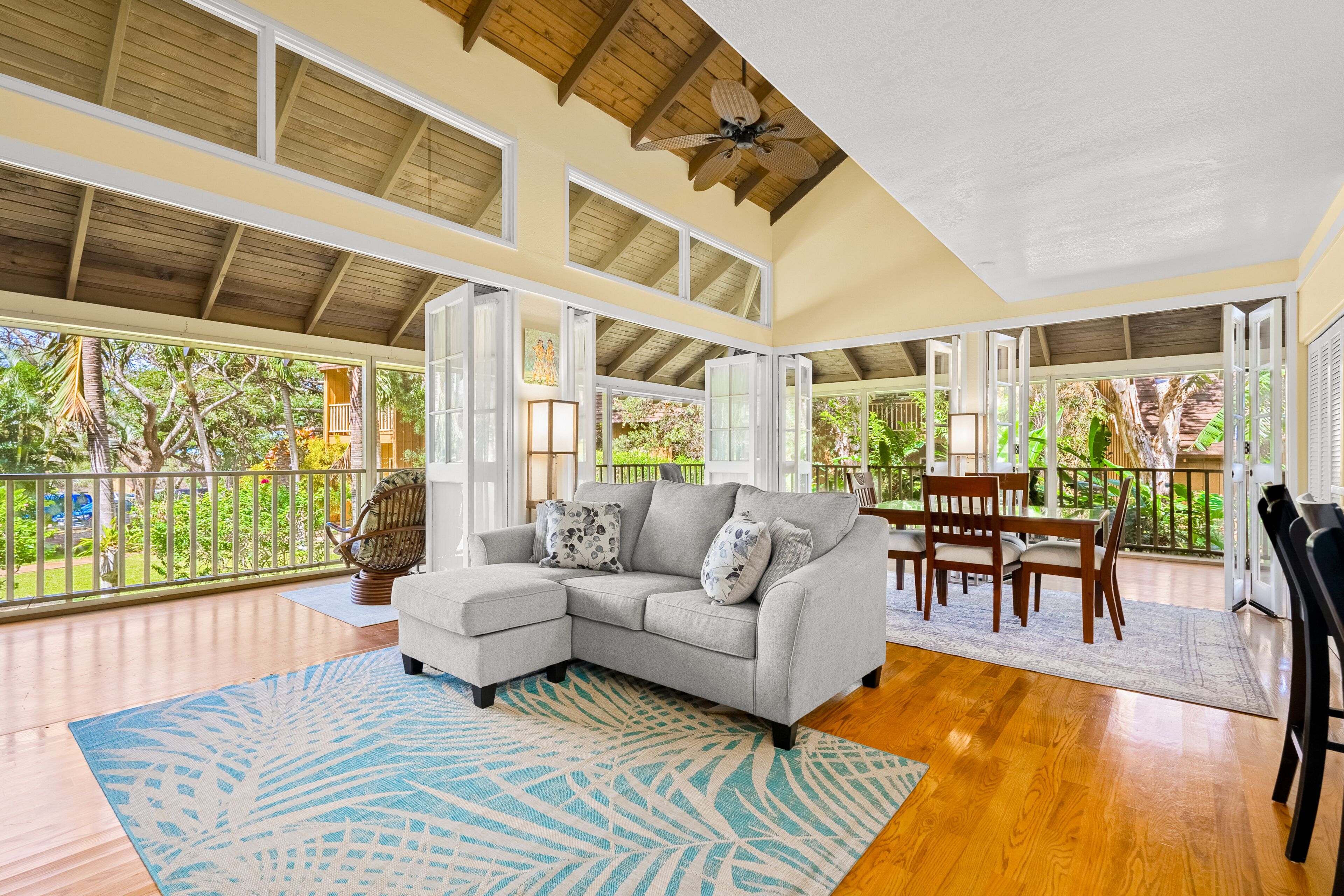 Tropical condo with wraparound lanai, quiet beaches, pool access, & W/D