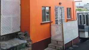 A two-story building with a flat roof and large windows. - Very clean 2-bedroom Apt. in St. Georges, Grenada (Saint George's)