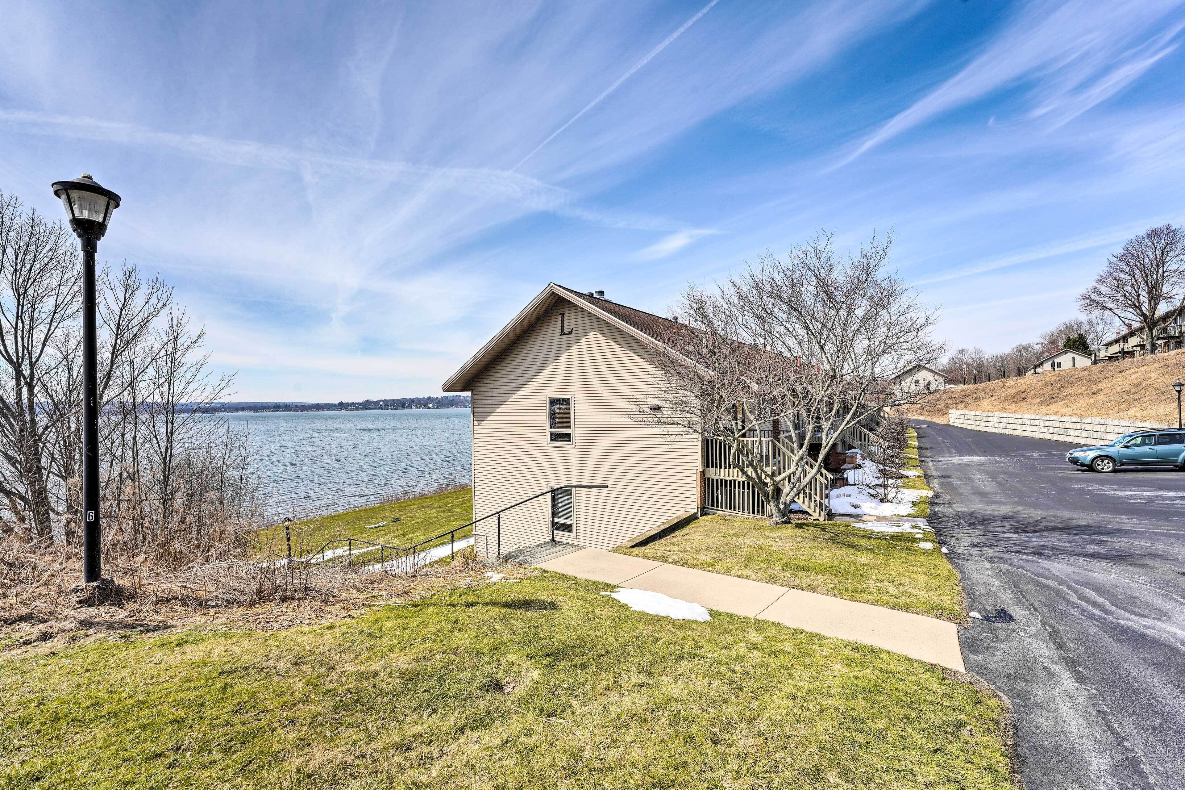 Waterfront Dewittville Condo w/ Furnished Balcony!