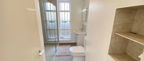 Shower, hair dryer, towels, soap