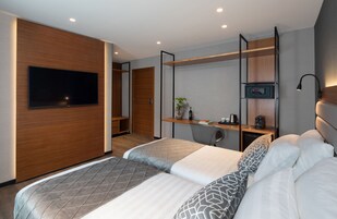 Superior Double or Twin Room | Minibar, in-room safe, desk, laptop workspace