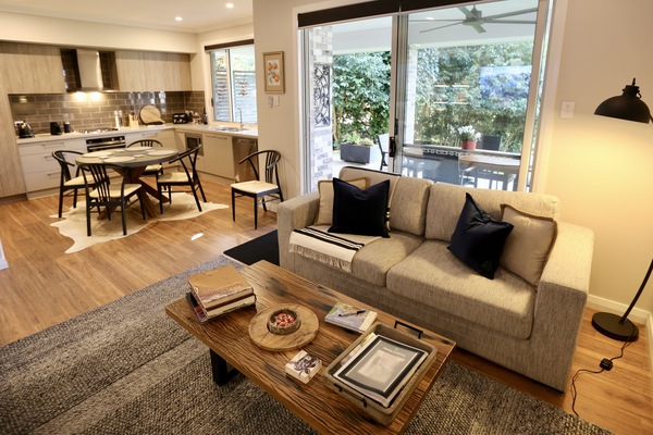 Open plan kitchen and living area with gas fireplace