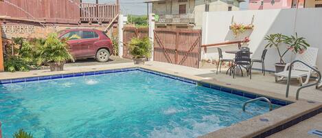 Outdoor pool, open 8:30 AM to 9:00 PM, pool loungers