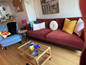 Relax in this inviting living room with a sofa, armchair, and coffee table.
