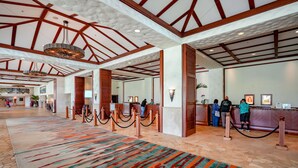 A spacious lobby with a high ceiling, wooden beams, and a colorful carpet. - Maui Resort Rentals: Marriott's Ko Olina Beach Club Studio Ocean View Villa (Oahu)