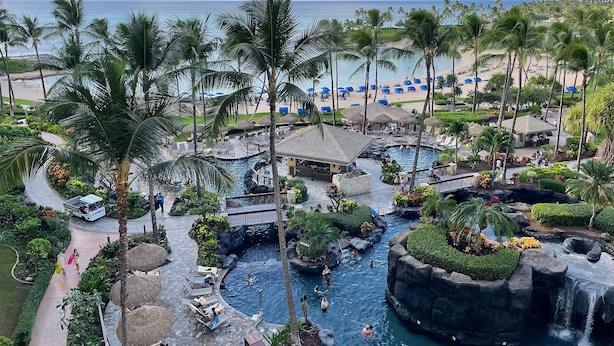 A resort with a pool area, palm trees, and a beach. - Maui Resort Rentals: Marriott's Ko Olina Beach Club Studio Ocean View Villa (Oahu)